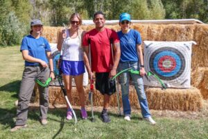 Anthony Robles, third from left, takes part in an archery session organized by Challenge Aspen on Friday at a private residence near Basalt. Robles, who was born with one leg, is a former national champion wrestler at Arizona State who is the inspiration behind a new film, “Unstoppable,” that was shown at Aspen Film’s 45th annual Filmfest. With him, from left, are Challenge Aspen’s Izzy DeGreen, Callie Dickson, and Daniele Mottier. Austin Colbert/The Aspen Times